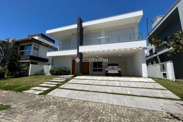 Casa em Condomínio para alugar ou comprar com 417m², 5 quartos, 4 suítes, 2 vagas no bairro Rio Tavares em Florianópolis