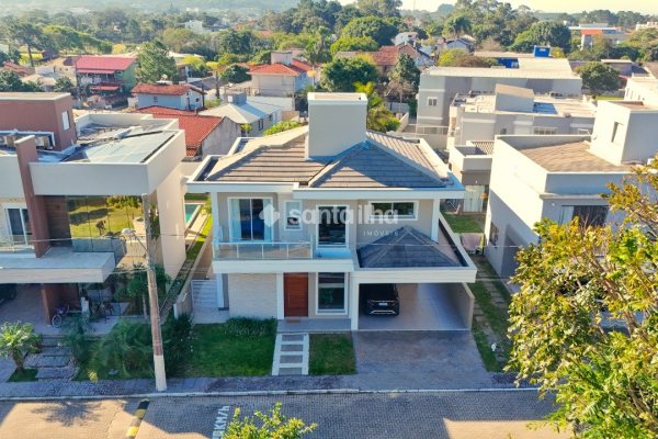 Casa em Condomínio à venda com 323m², 3 quartos, 3 suítes, 2 vagas no bairro Campeche em Florianópolis