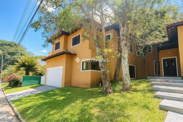 Casa em Condomínio à venda com 311m², 4 quartos, 4 suítes, 2 vagas no bairro Rio Tavares em Florianópolis